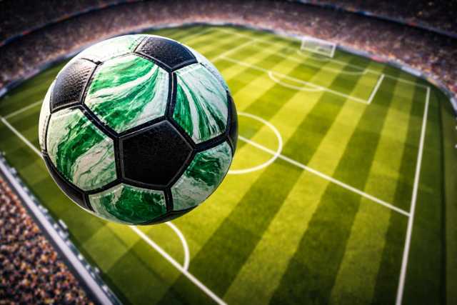 green-soccer-ball-above-stadium