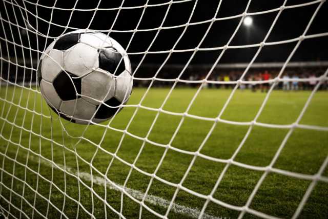 soccer-ball-in-goal-net-night