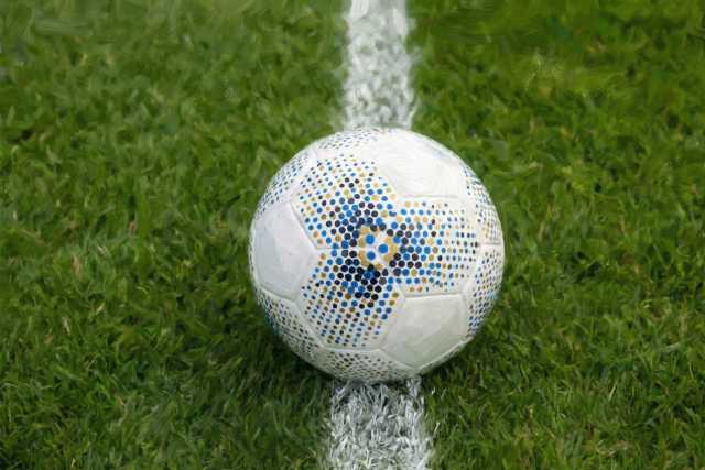 soccer-ball-on-center-line-grass-field