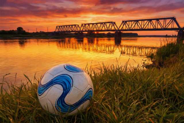 soccer-ball-riverside-bridge-sunset