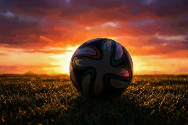 soccer-ball-silhouette-sunset-field